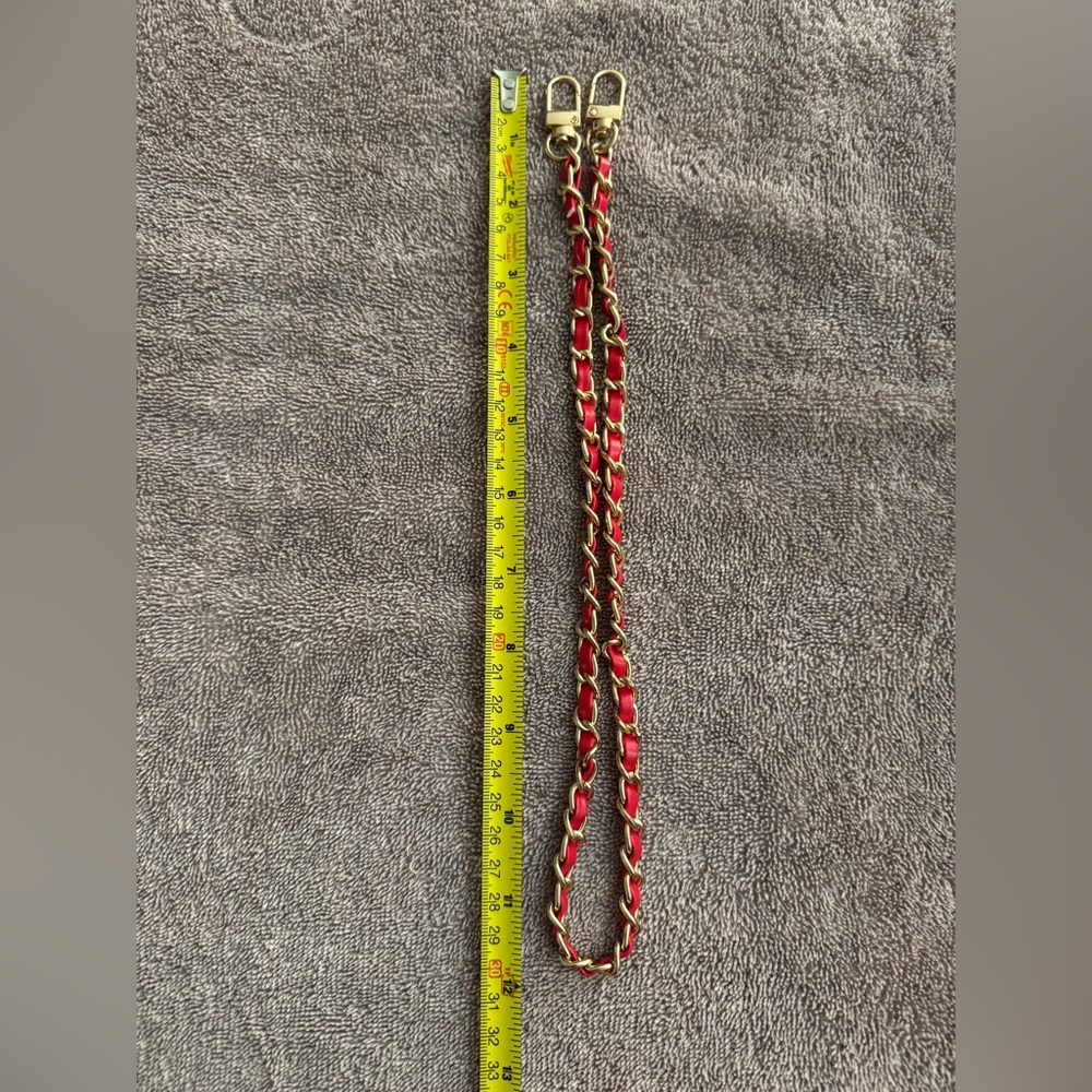 Gold with red pleather chain brand new